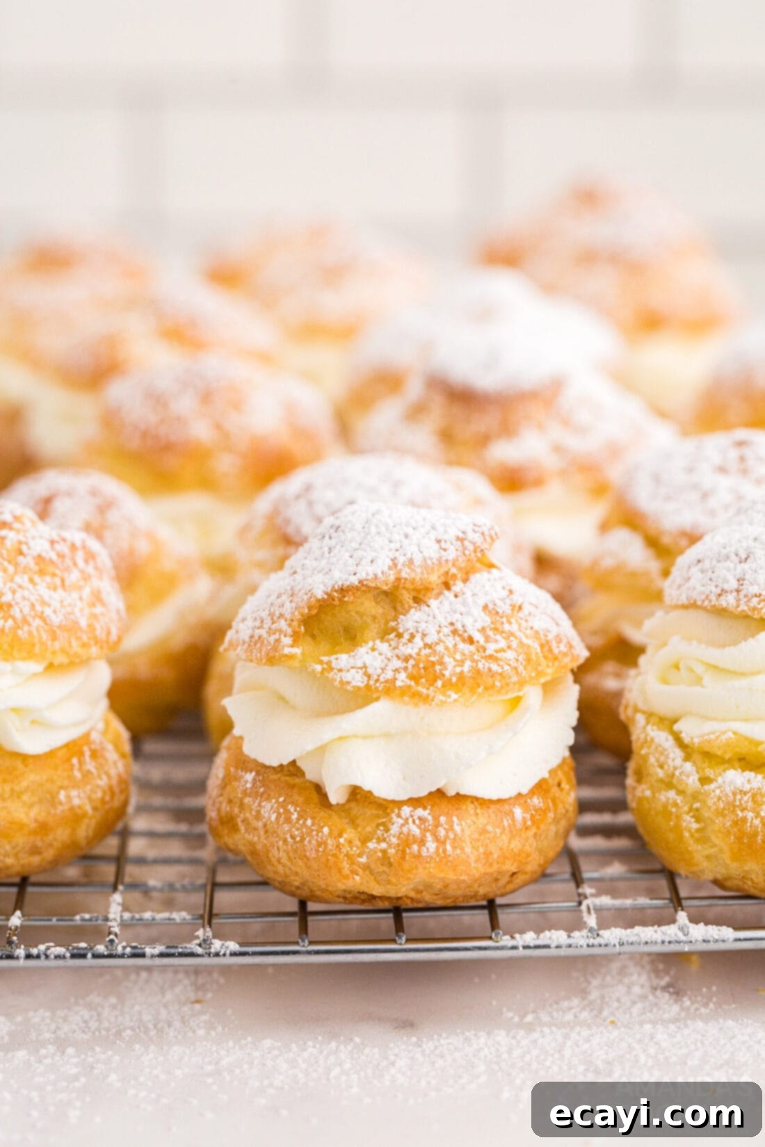 Golden Choux Delights 3 cooling rack of Cream Puffs