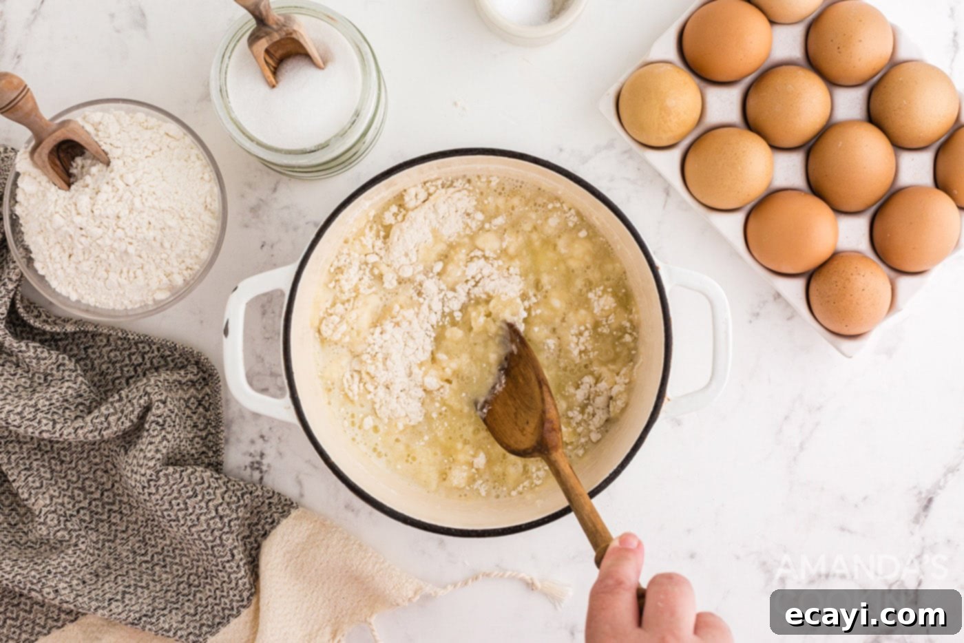 Golden Choux Delights 6 stirring flour into butter mixture in saucepan