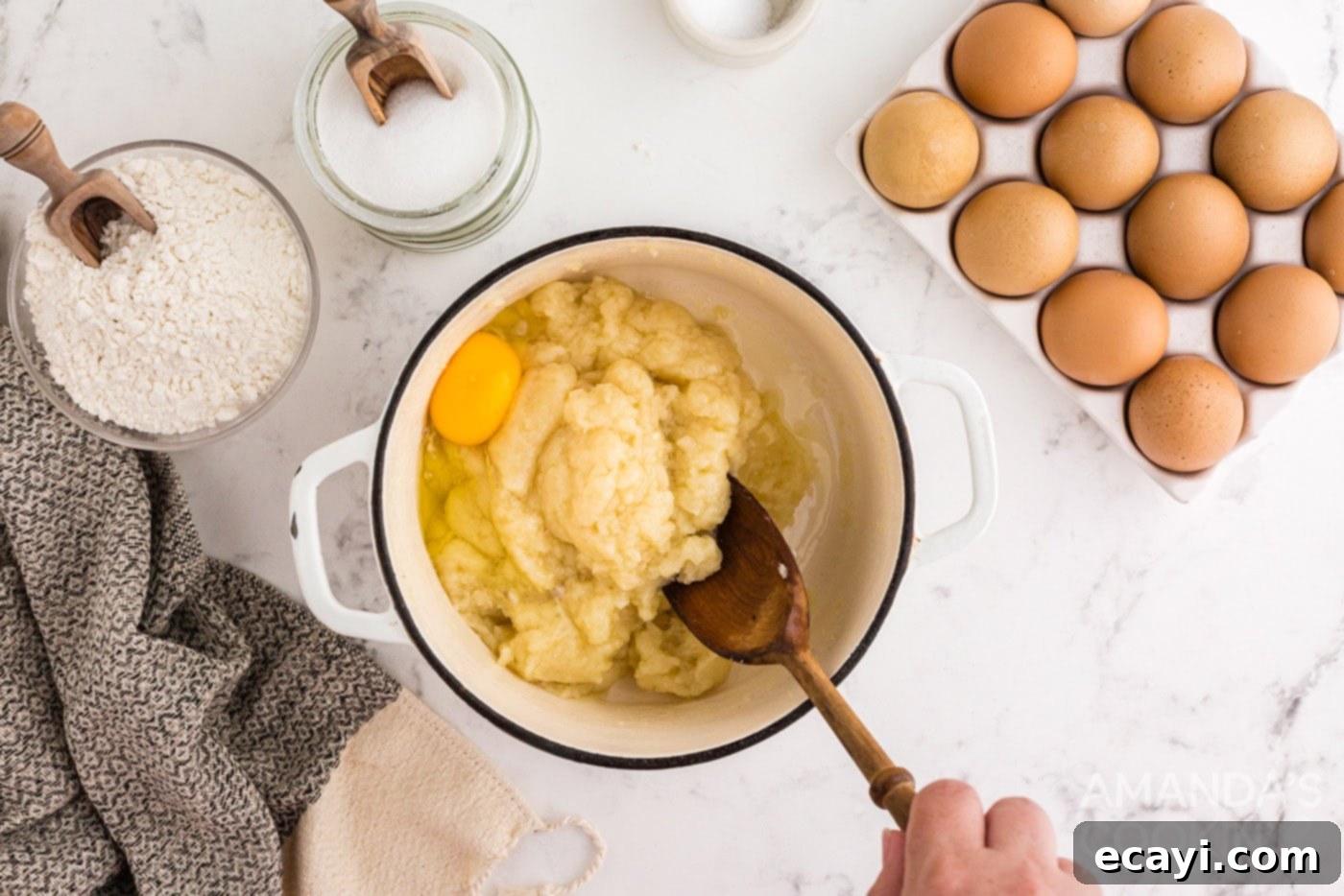 Golden Choux Delights 7 stirring egg into dough mixture