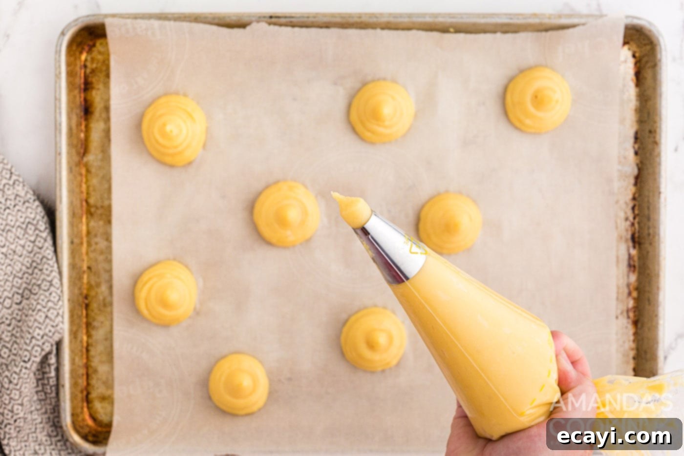 Golden Choux Delights 9 piping choux pastry dough onto baking sheet