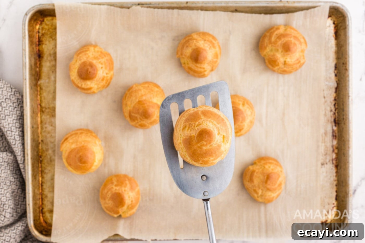 Golden Choux Delights 10 golden brown choux pastry on spatula