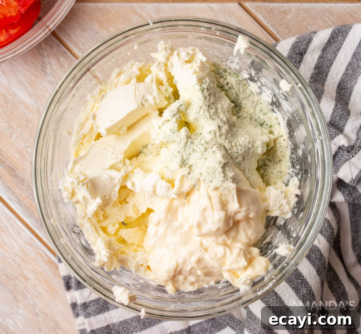Swirl Sandwiches 5 Cream cheese, mayonnaise, and ranch seasoning being mixed in a bowl