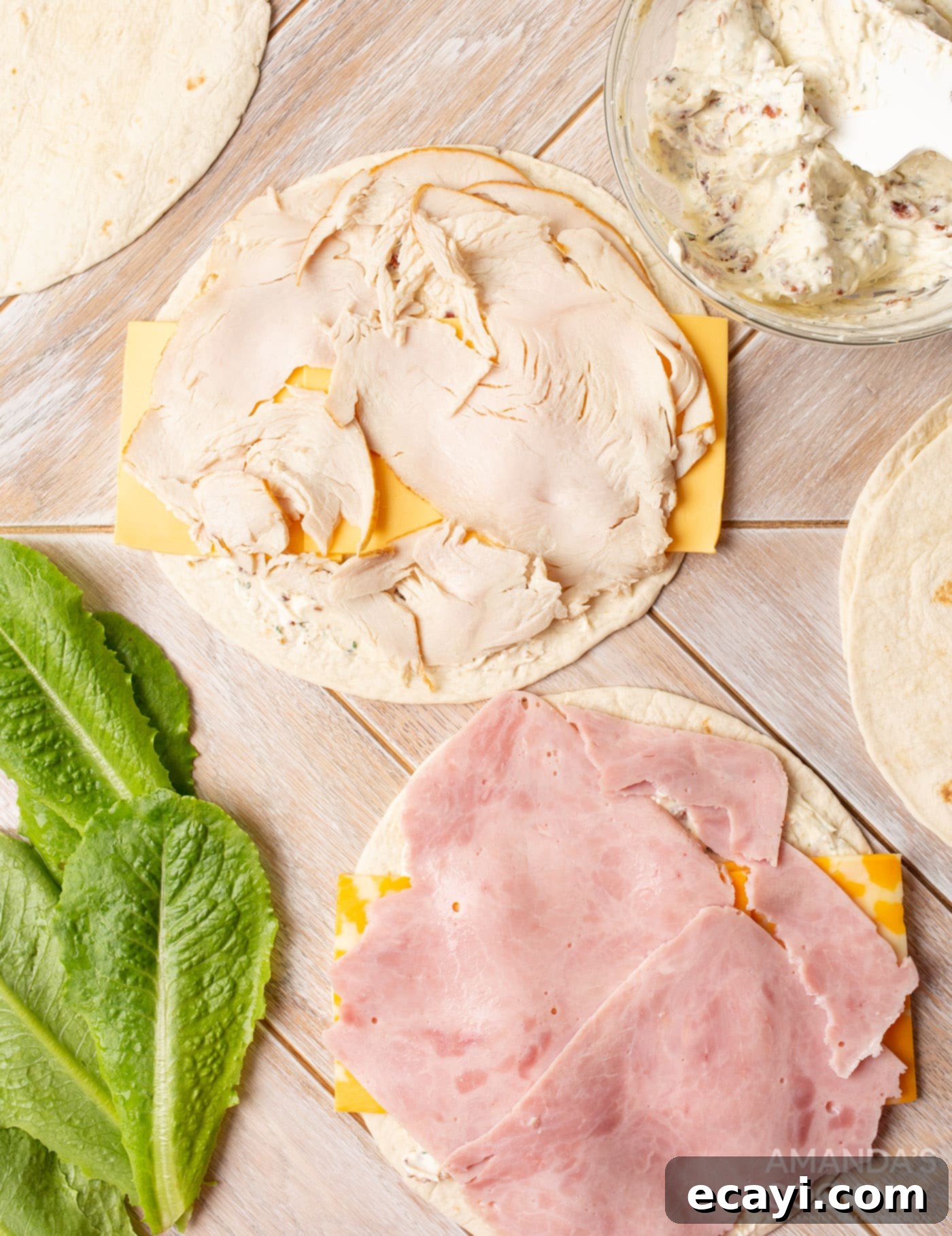 Swirl Sandwiches 8 Deli meat layered on top of cheese and cream cheese spread on a tortilla
