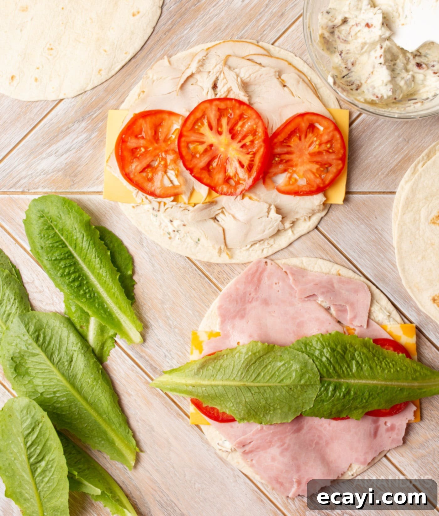 Swirl Sandwiches 9 Tomato slices and lettuce leaves added to pinwheel sandwich tortillas