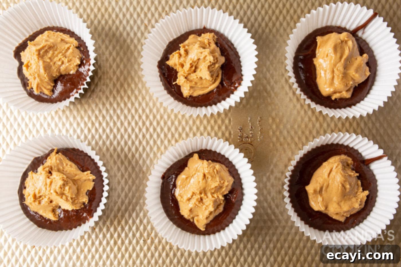 Pure Peanut Butter Bliss 6 peanut butter on top of chocolate in a cupcake liner