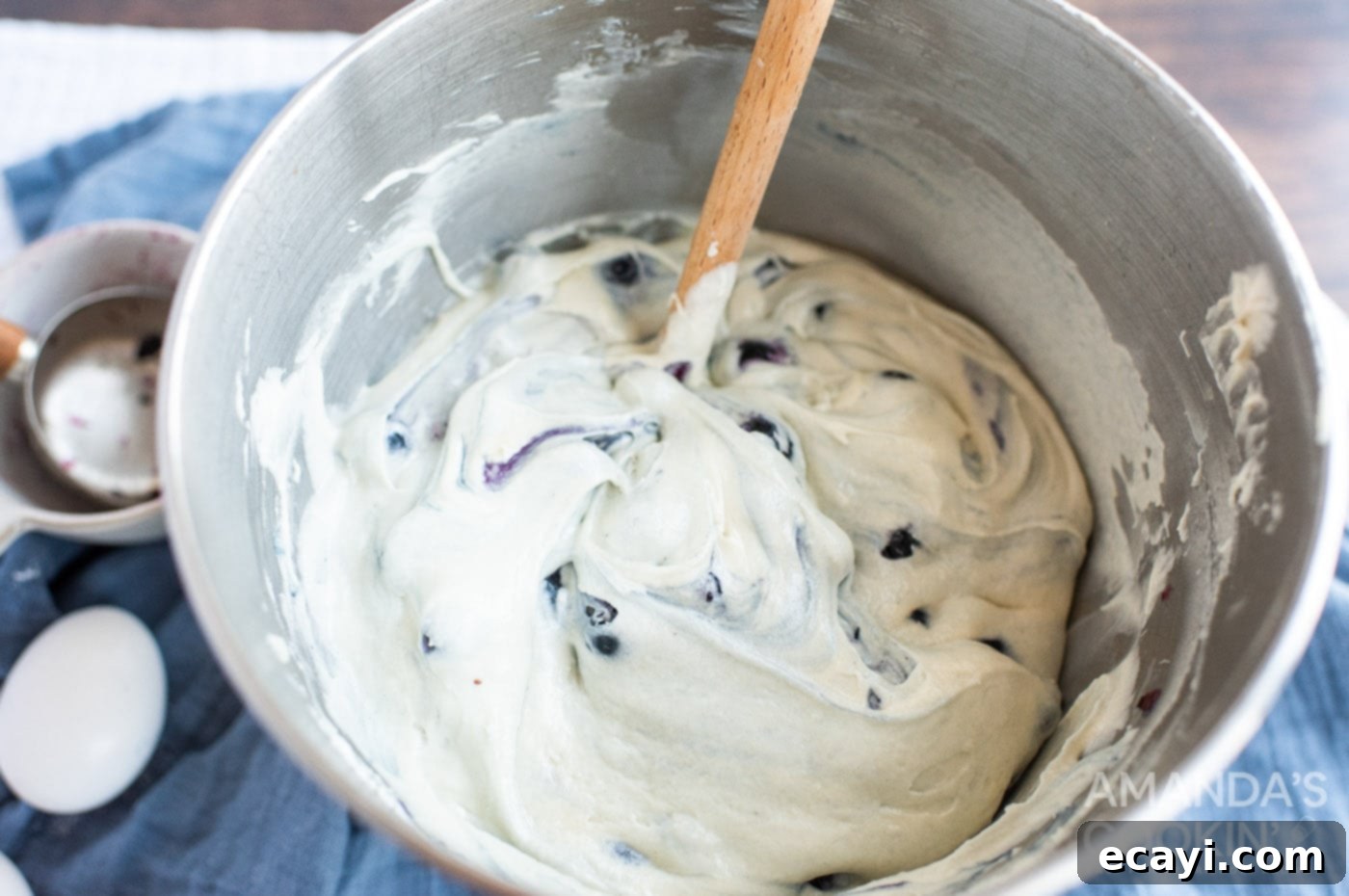 Blueberry Bliss Bundt 6 Gently stirring blueberries into the cake batter with a spatula