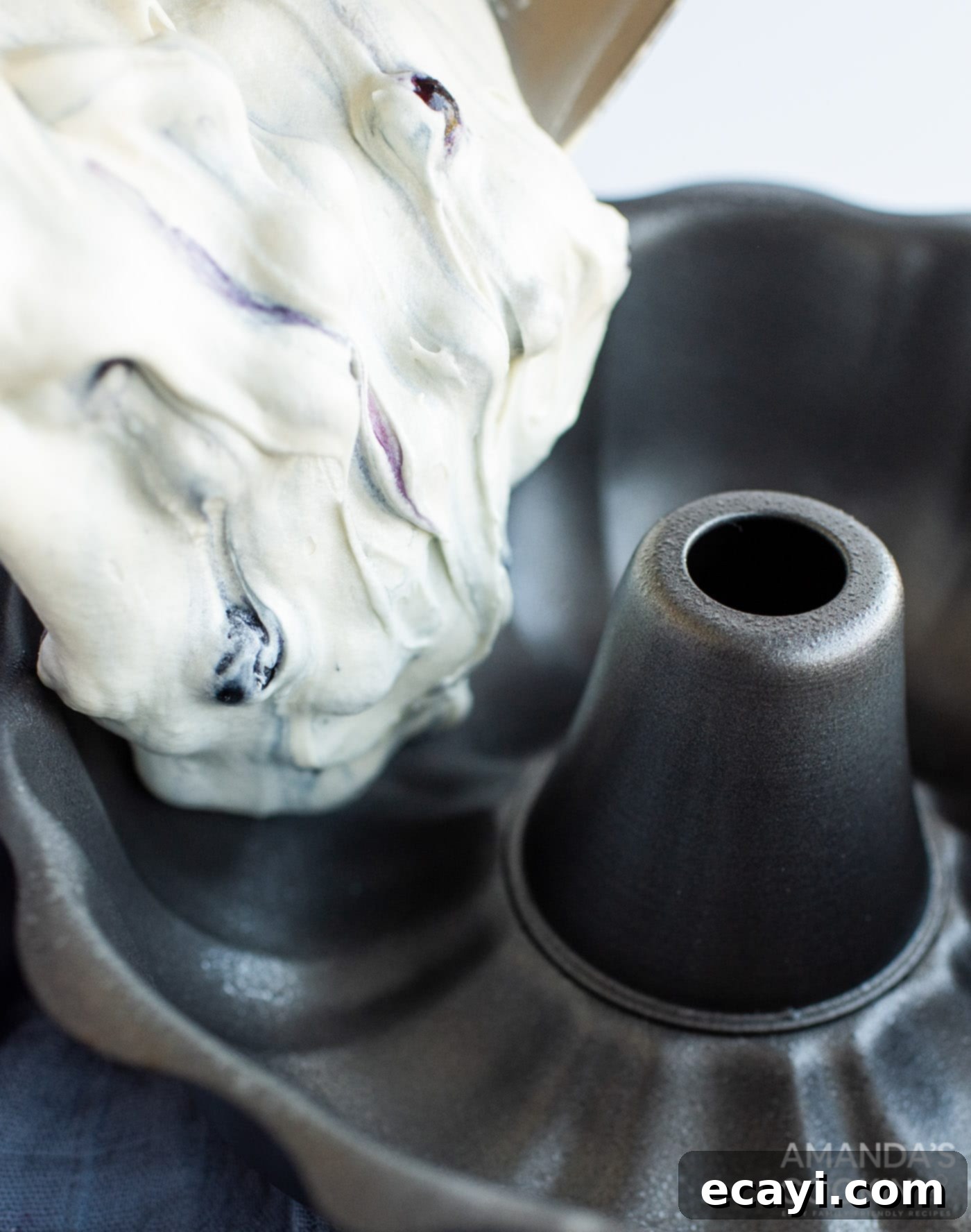 Blueberry Bliss Bundt 7 Pouring the blueberry cake batter into a bundt pan