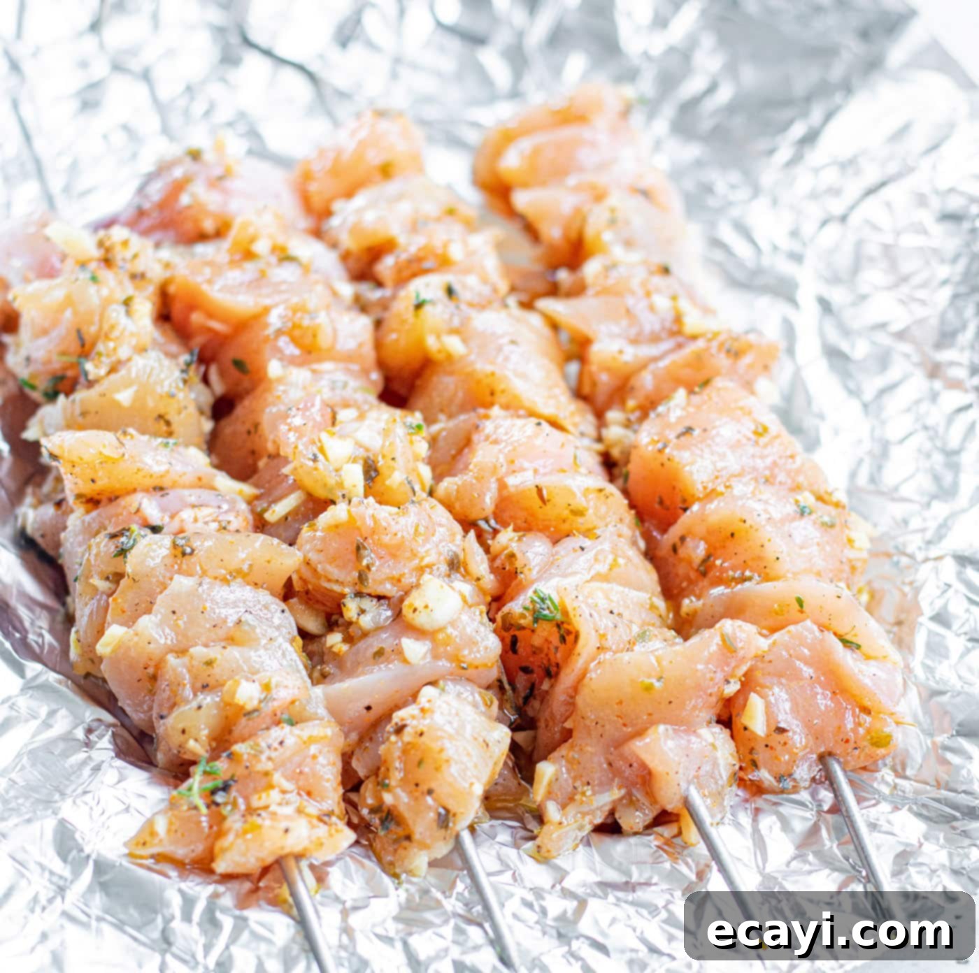 Lemon-Herb Mediterranean Chicken Skewers 7 Marinated chicken threaded onto skewers, ready for grilling