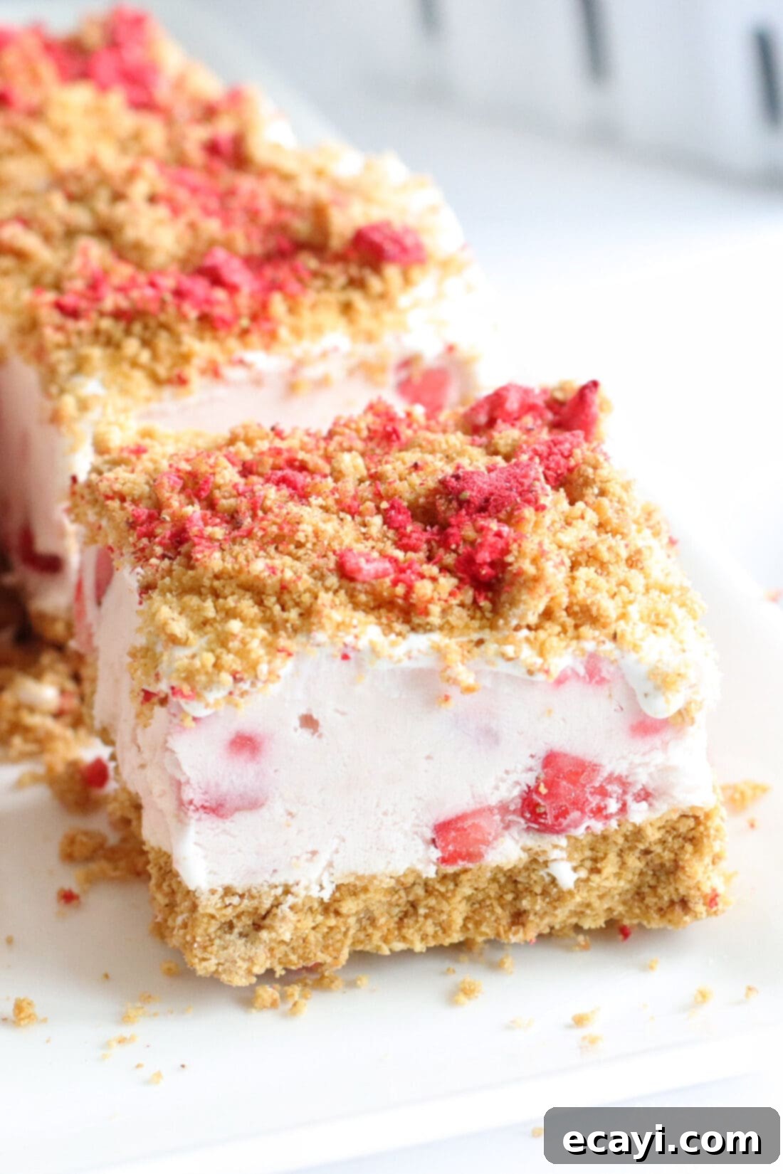 Effortless Strawberry Cheesecake Bars 2 slice of No Bake Strawberry Cheesecake Bars with a perfect creamy filling and graham cracker crust