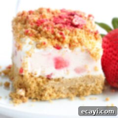 Effortless Strawberry Cheesecake Bars 12 No Bake Strawberry Cheesecake Bar on a white plate