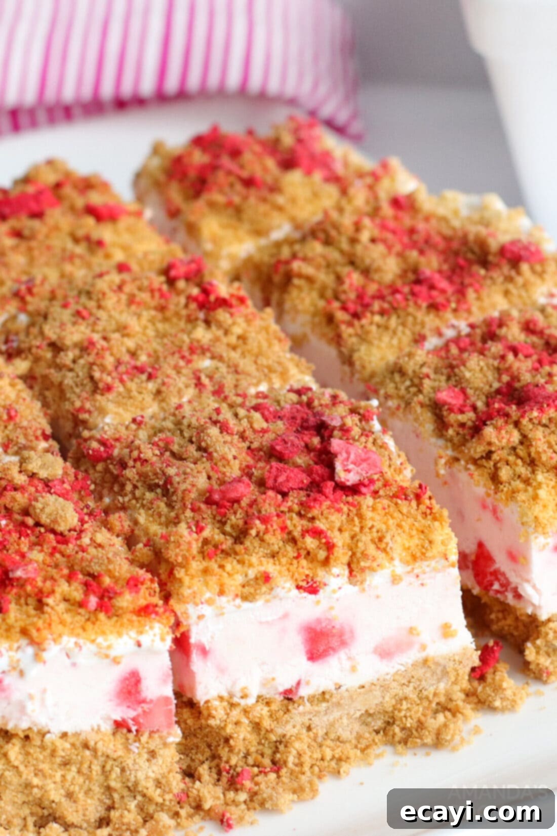 Effortless Strawberry Cheesecake Bars 3 No Bake Strawberry Cheesecake Bars ready to be served