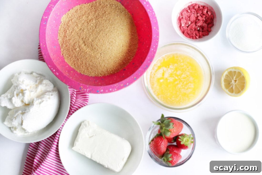 Effortless Strawberry Cheesecake Bars 4 ingredients laid out for No Bake Strawberry Cheesecake Bars, including strawberries, cream cheese, and graham crackers