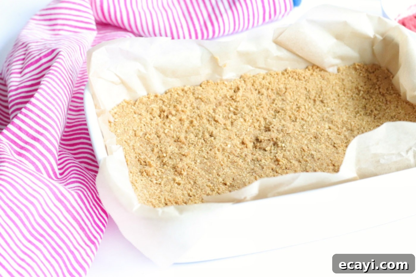 Effortless Strawberry Cheesecake Bars 6 graham cracker crumb crust pressed firmly into a baking dish