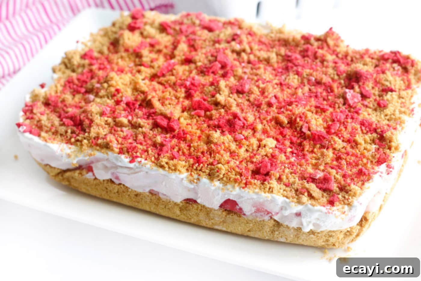 Effortless Strawberry Cheesecake Bars 10 finished no bake strawberry cheesecake bars with freeze-dried strawberry topping