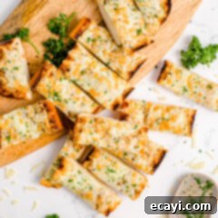 Garlic Cheese Bliss 11 sliced garlic bread on a cutting board