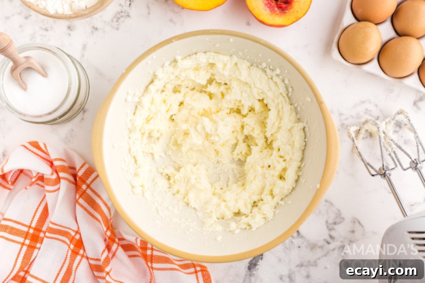 Golden Peach Crown Cake 7 Softened butter and granulated sugar beaten until light and fluffy in a mixing bowl with an electric mixer.