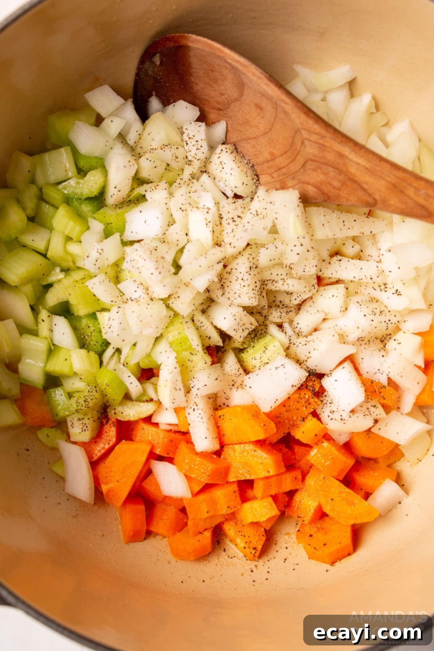 Golden Chicken Noodle Comfort 6 carrots, onion, and celery in a pot