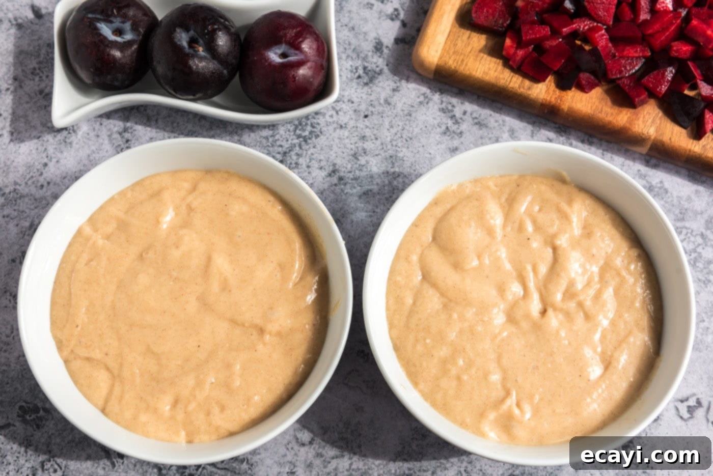 Sparkling Sugar Plum Muffins 12 The plum muffin batter evenly divided into two separate mixing bowls.