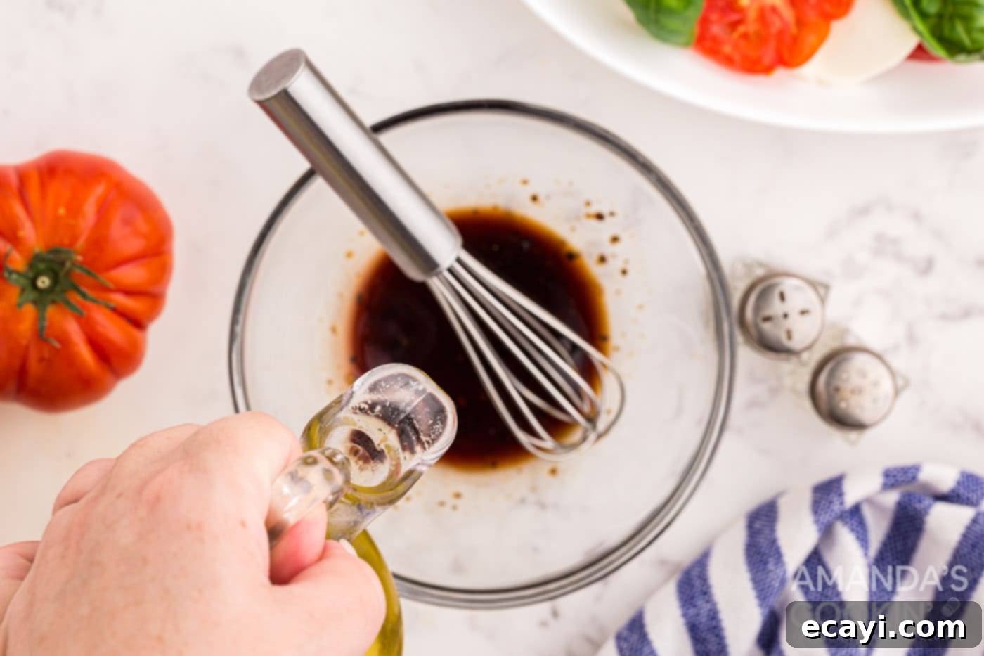 Fresh Caprese Salad 7 balsamic, pepper, olive oil, and salt in a bowl with whisk