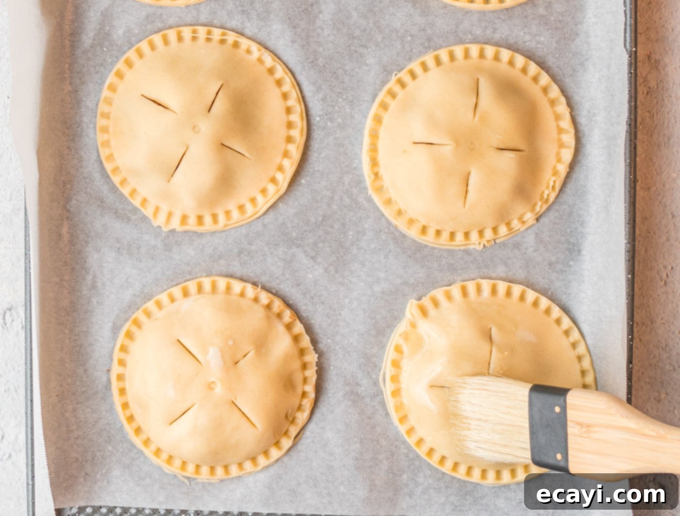 Golden Apple Pockets 9 Crimping edges of apple hand pies with a fork