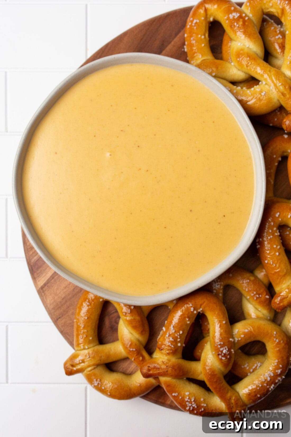 Hoppy Cheese Indulgence 3 bowl of Beer Cheese Dip surrounded by pretzels