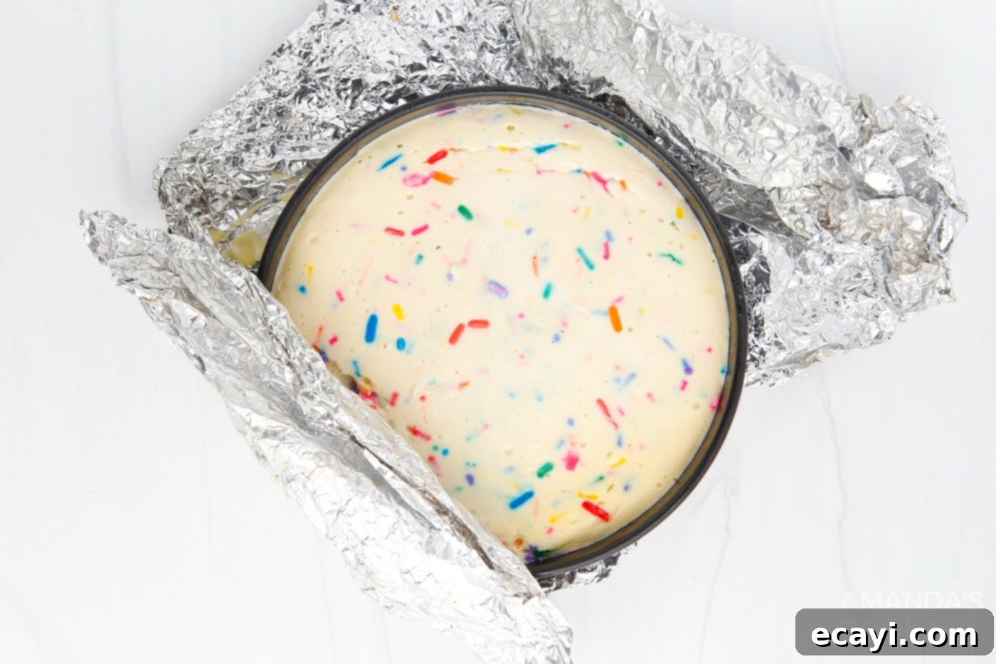 Effortless Instant Pot Funfetti Cheesecake 9 Unwrapping the cooled Instant Pot Funfetti Cheesecake