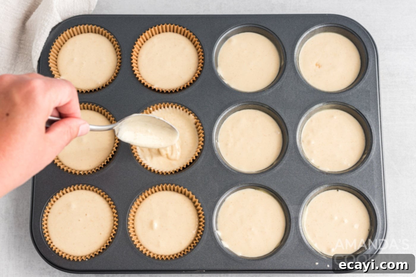 Genius 3-Ingredient Apple Pie Cupcakes 6 spoon scooping cupcake batter into baking pan