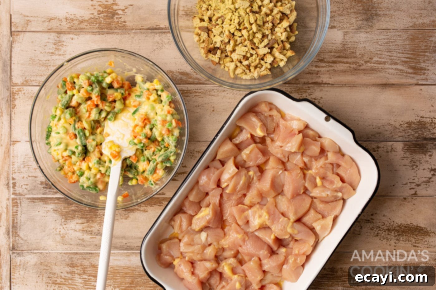 Savory Chicken and Stuffing Bake 5 diced chicken in a casserole dish with veggies and stuffing