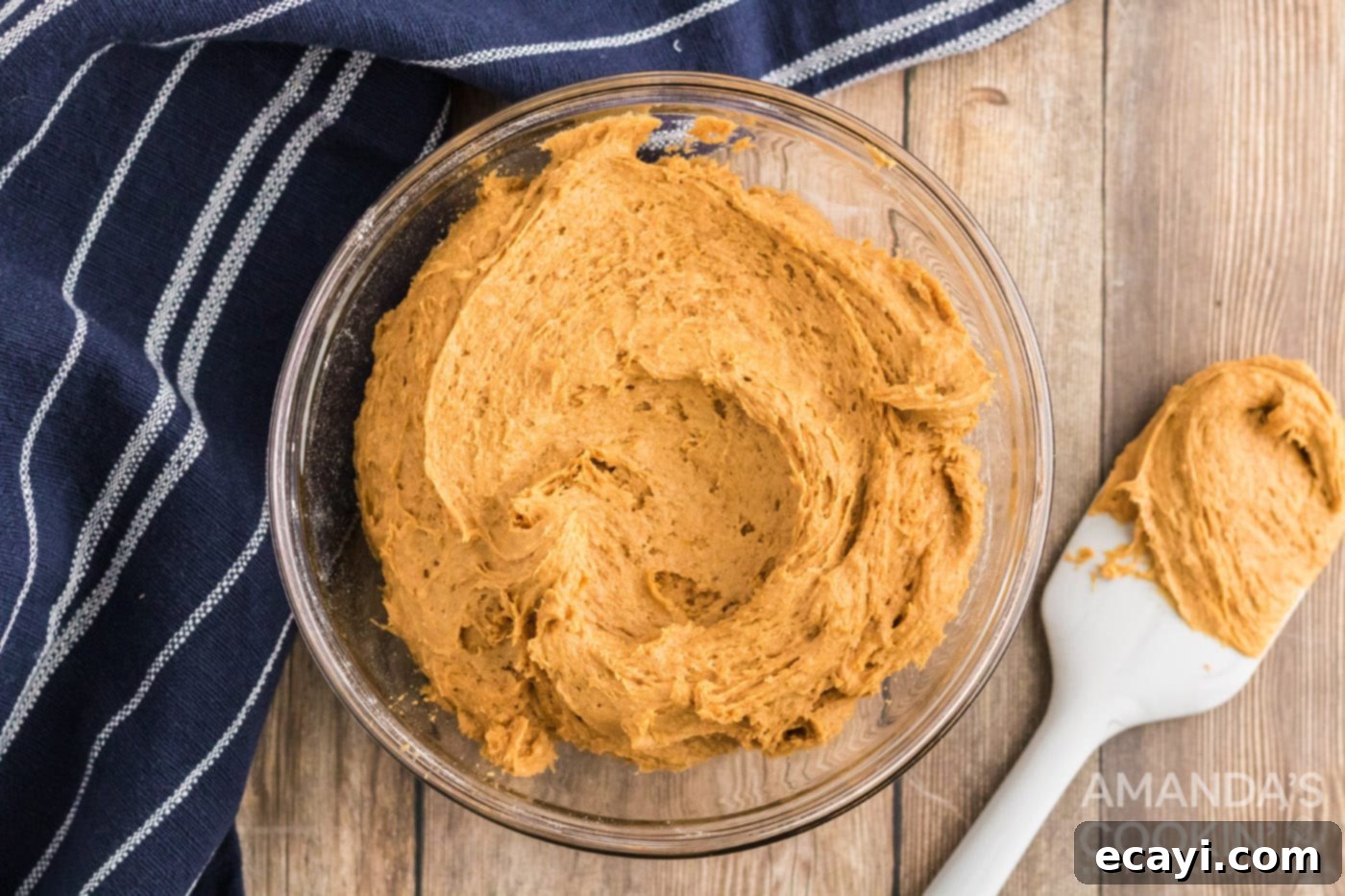 Easy Pumpkin Cake Mix Cookies 6 Pumpkin puree mixed with cake mix in a bowl, forming cookie dough