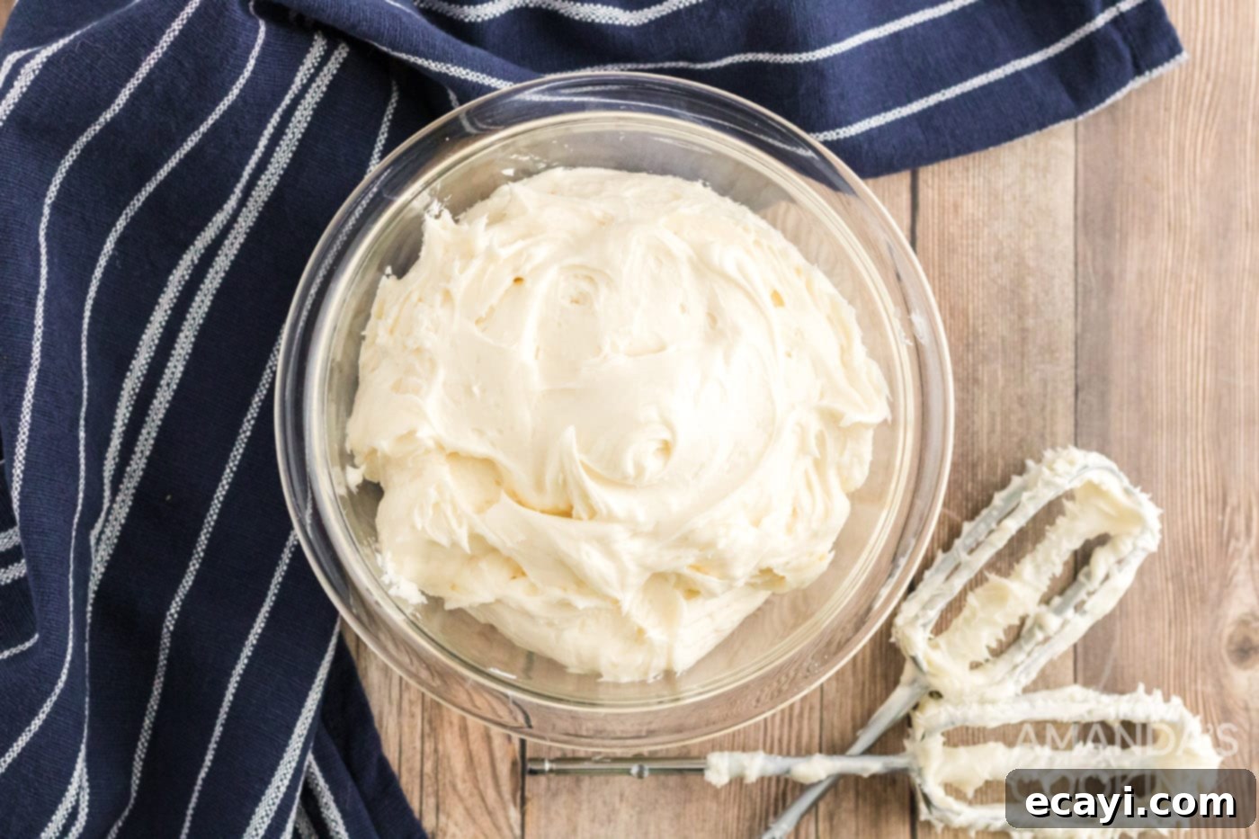 Easy Pumpkin Cake Mix Cookies 8 Cream cheese frosting in a mixing bowl, ready to be spread