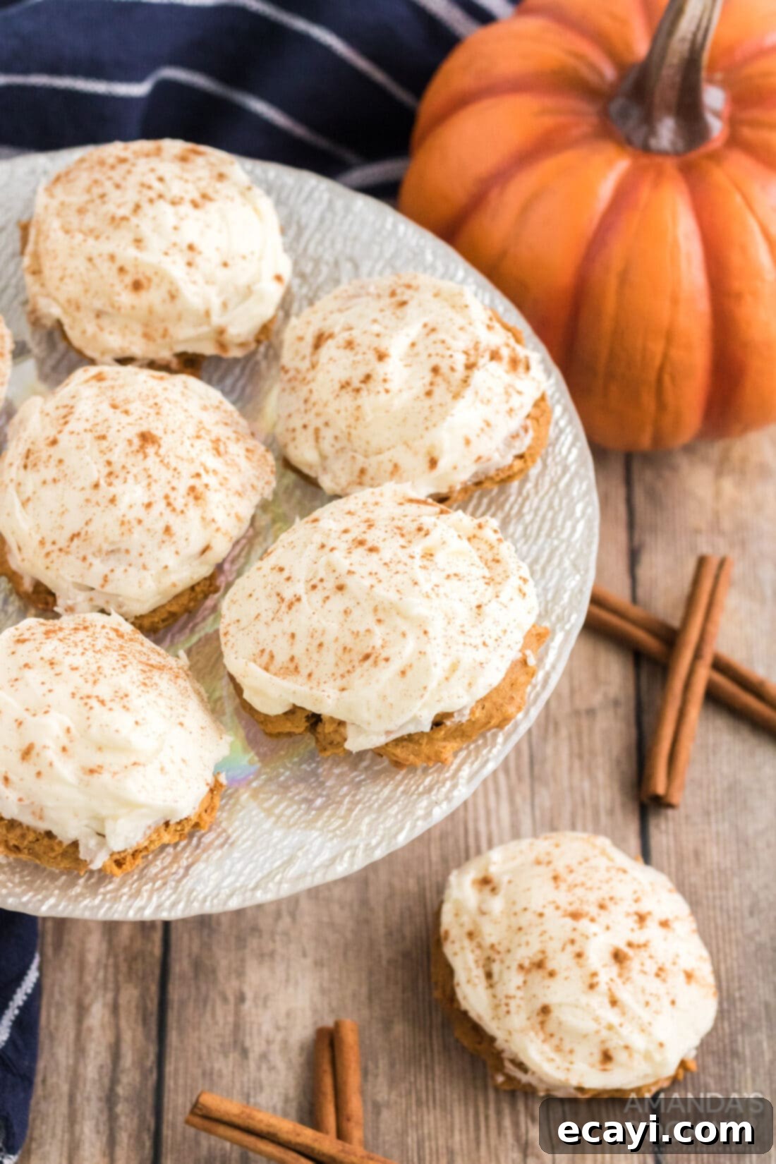 Easy Pumpkin Cake Mix Cookies 10 A plate of freshly baked and frosted Pumpkin Cake Mix Cookies