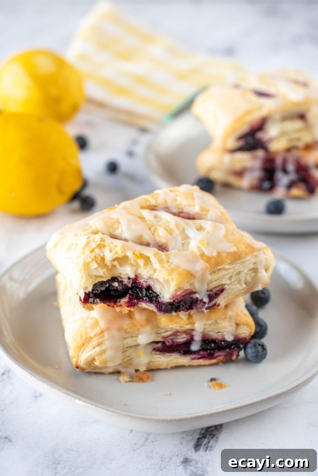 Sunshine Berry Pastry Pockets 3 Lemon Blueberry Croissant Hand Pie with a bite out of it