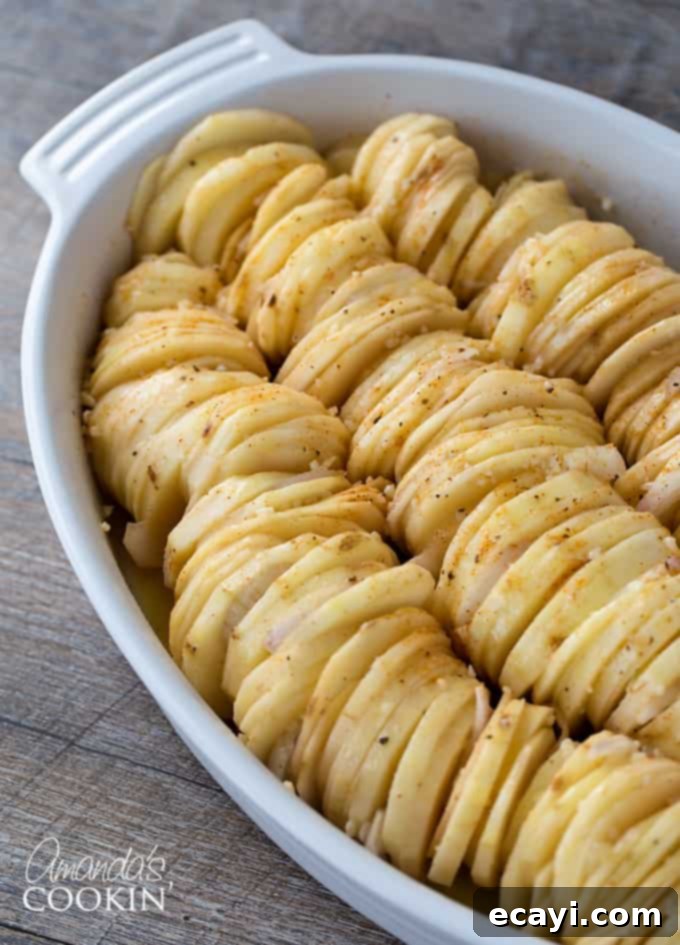Golden Crispy Roast Potatoes 5 Crispy Roast Potatoes Step 2: Arranging slices and adding shallots