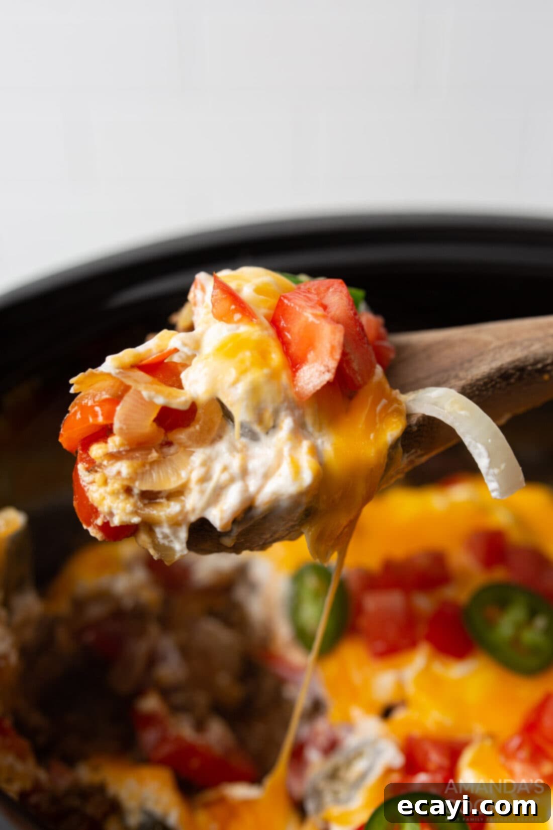 Hearty Slow Cooker John Wayne Casserole 11 serving spoon of crockpot john wayne casserole