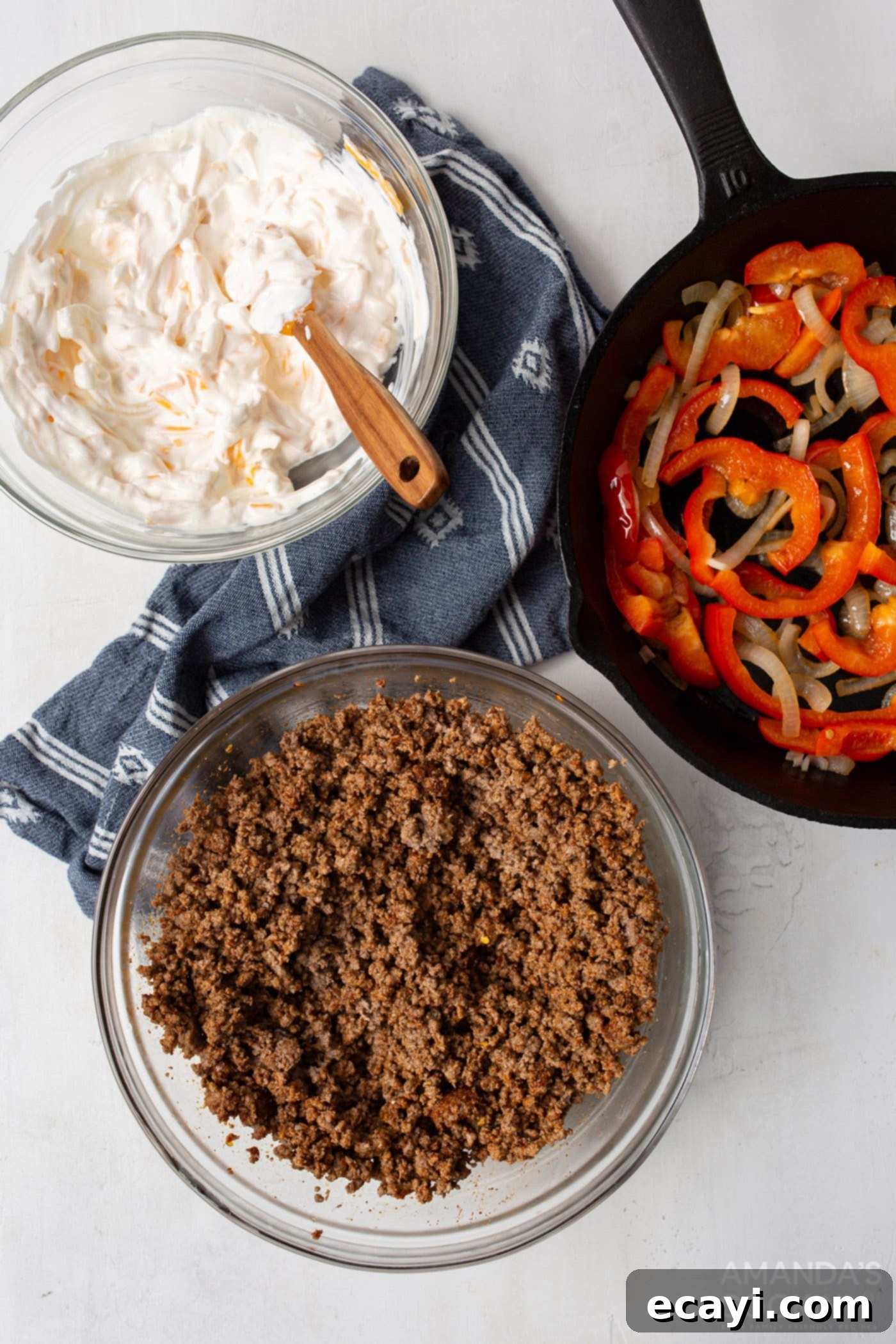 Hearty Slow Cooker John Wayne Casserole 6 ground beef, sour cream mixture, and veggies overhead