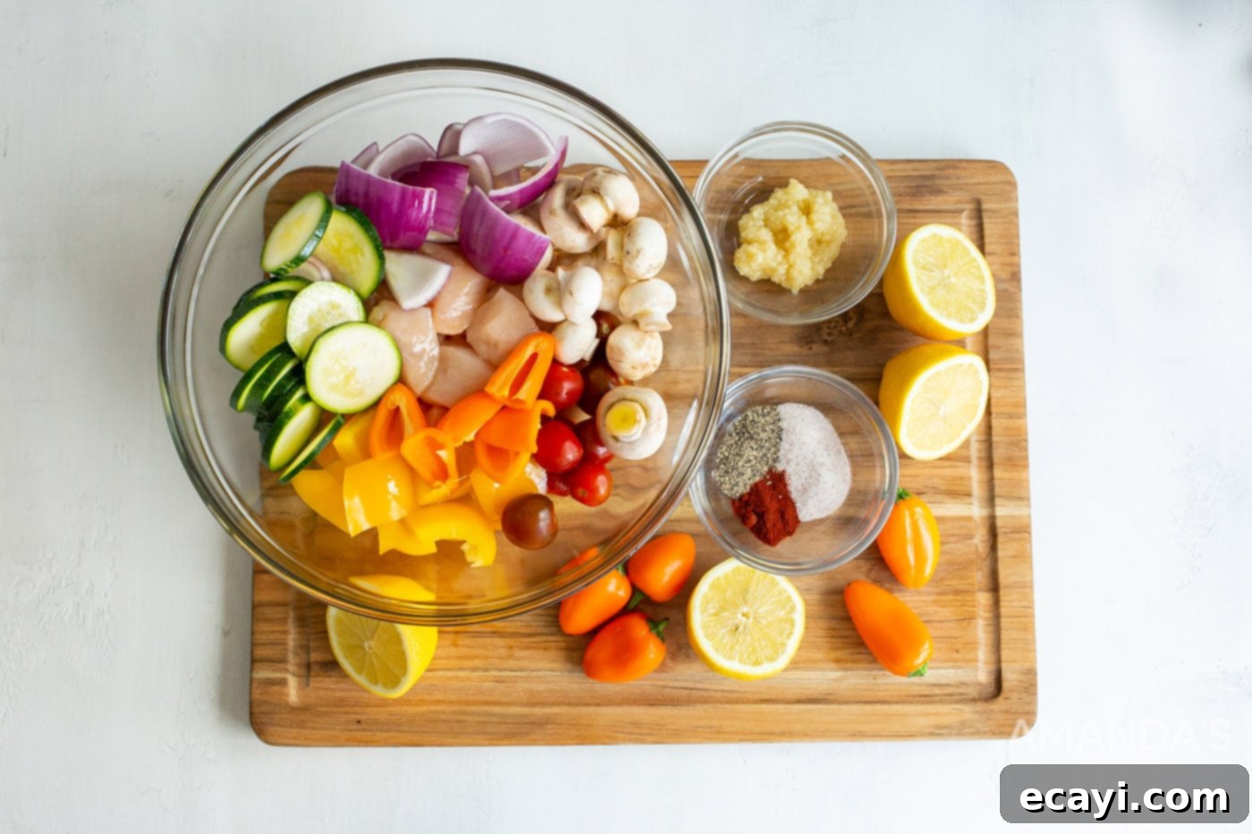 Effortless Air Fryer Chicken Kabobs 5 Sliced chicken and vegetables in a bowl, ready for marinade