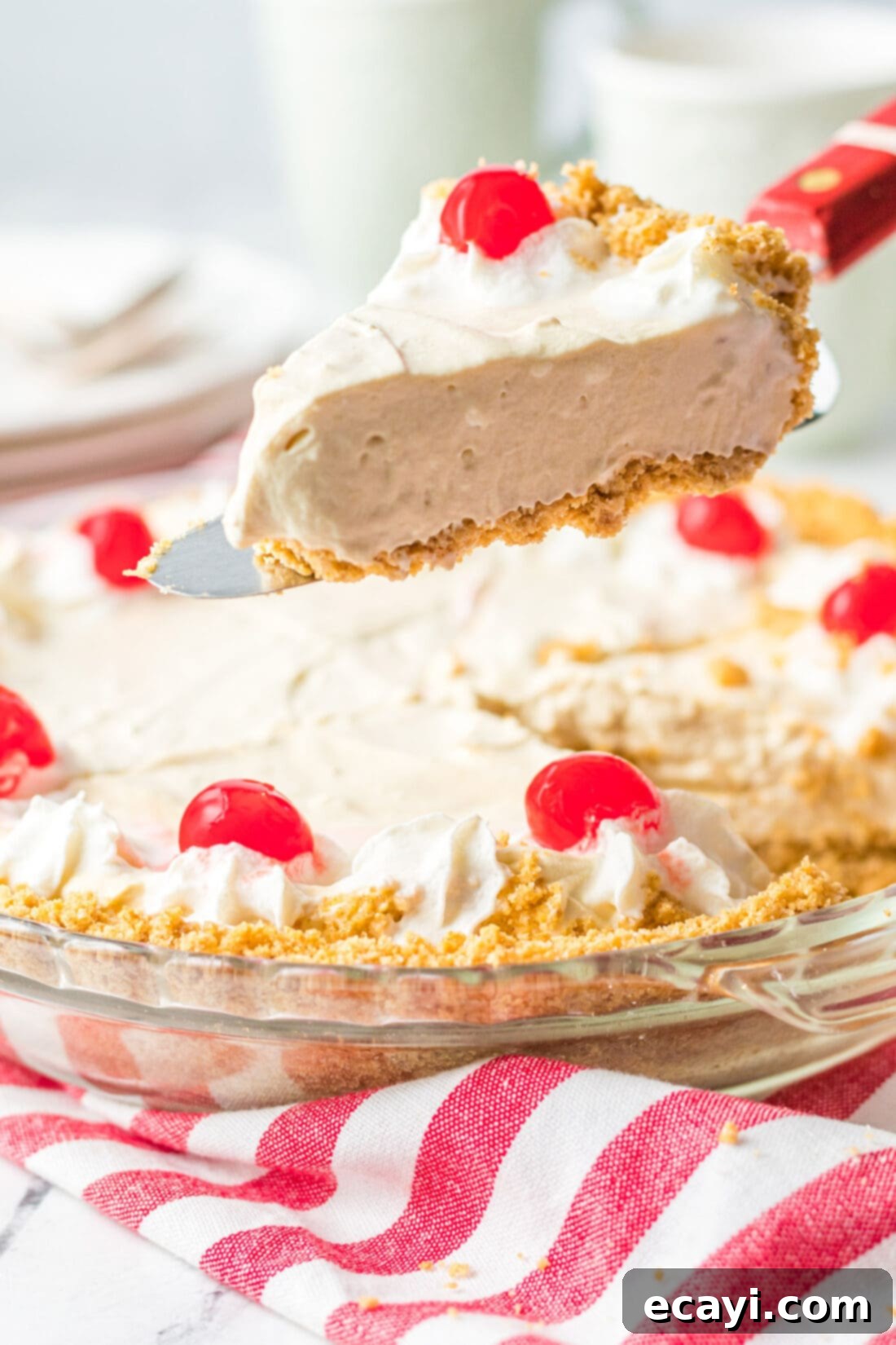 Frothy Root Beer Dream Pie 3 Lifting a slice of creamy Root Beer Float Pie from the pan