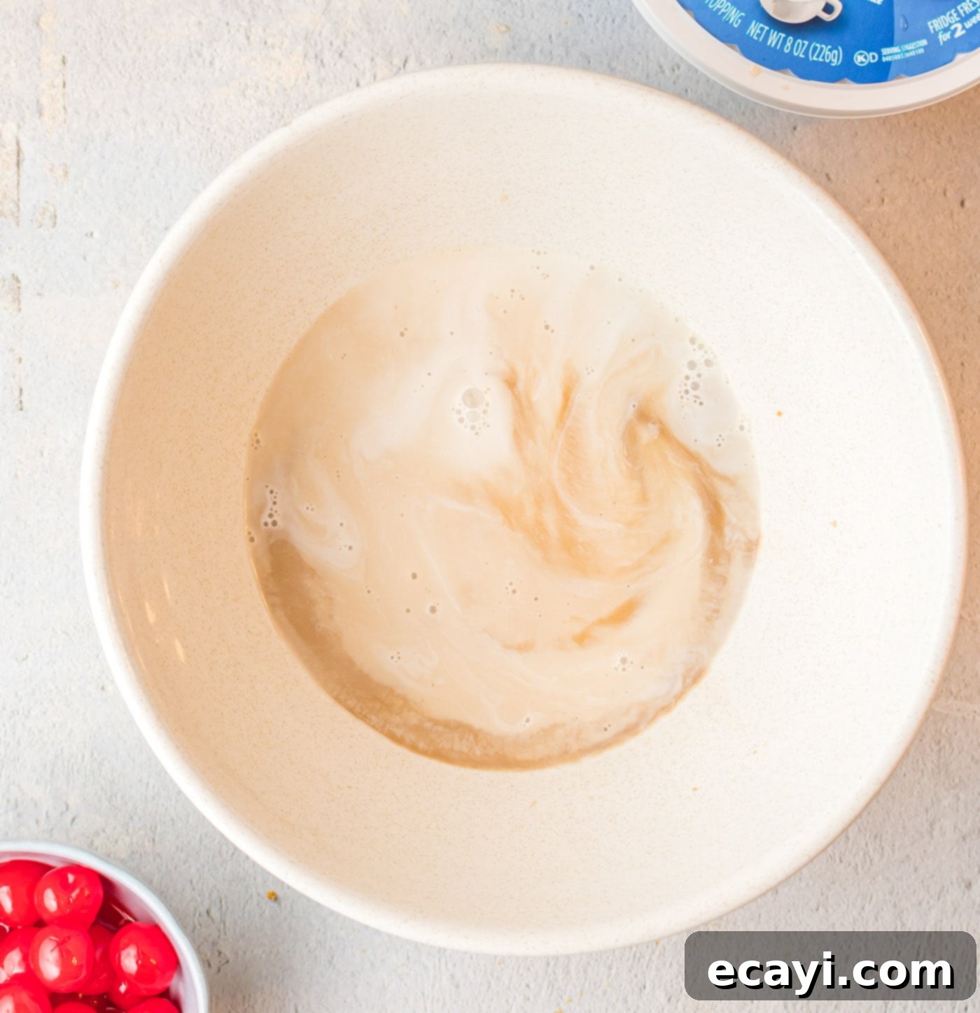 Frothy Root Beer Dream Pie 7 Root beer, root beer flavoring, and heavy whipping cream in a bowl for the pie filling