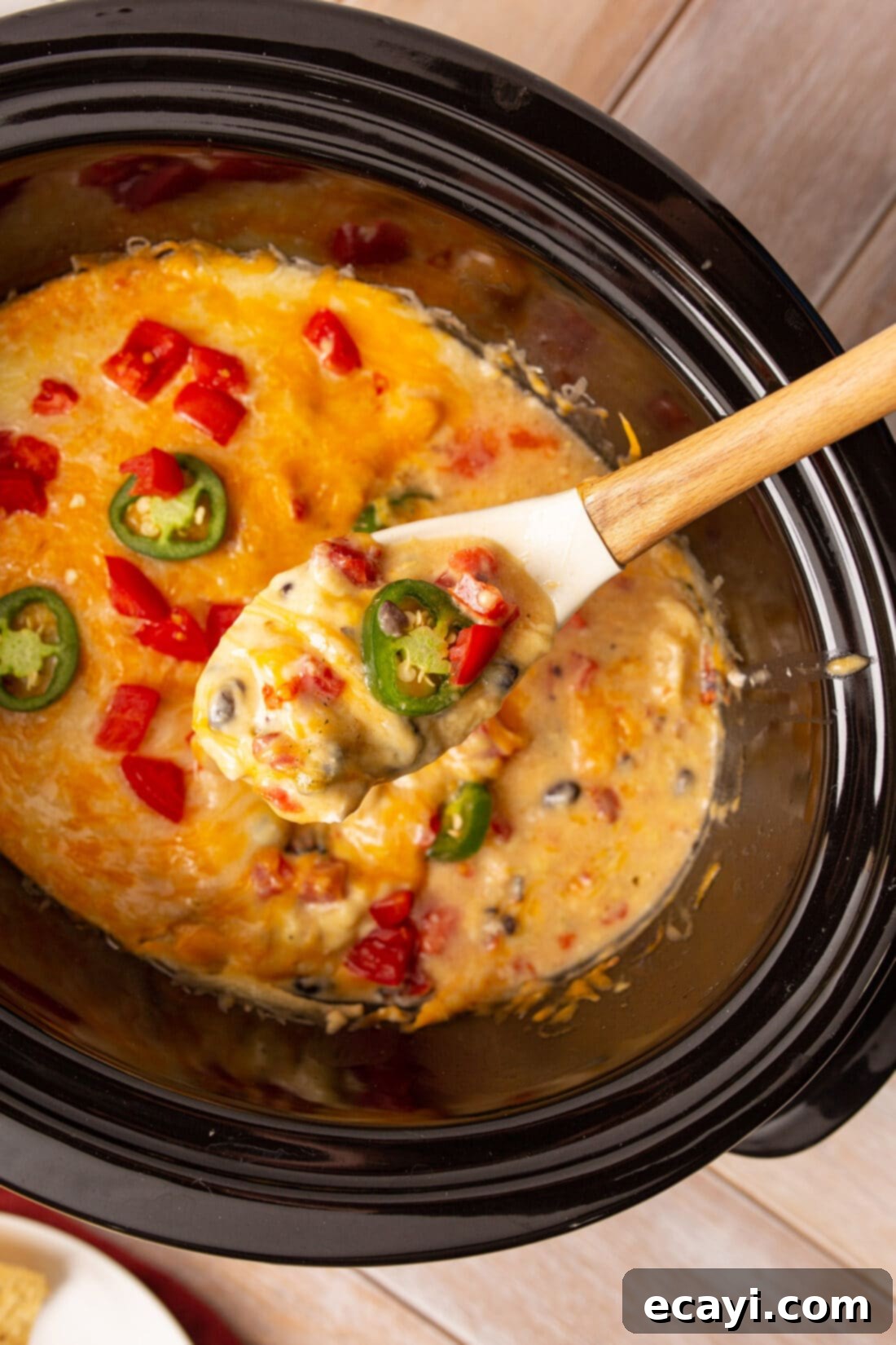 Slow Cooker Mexican Shredded Chicken 2 serving spoon of crockpot mexican chicken