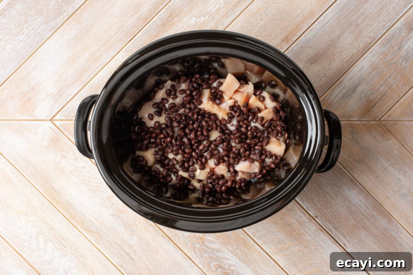 Slow Cooker Mexican Shredded Chicken 5 chicken and black beans in a slow cooker