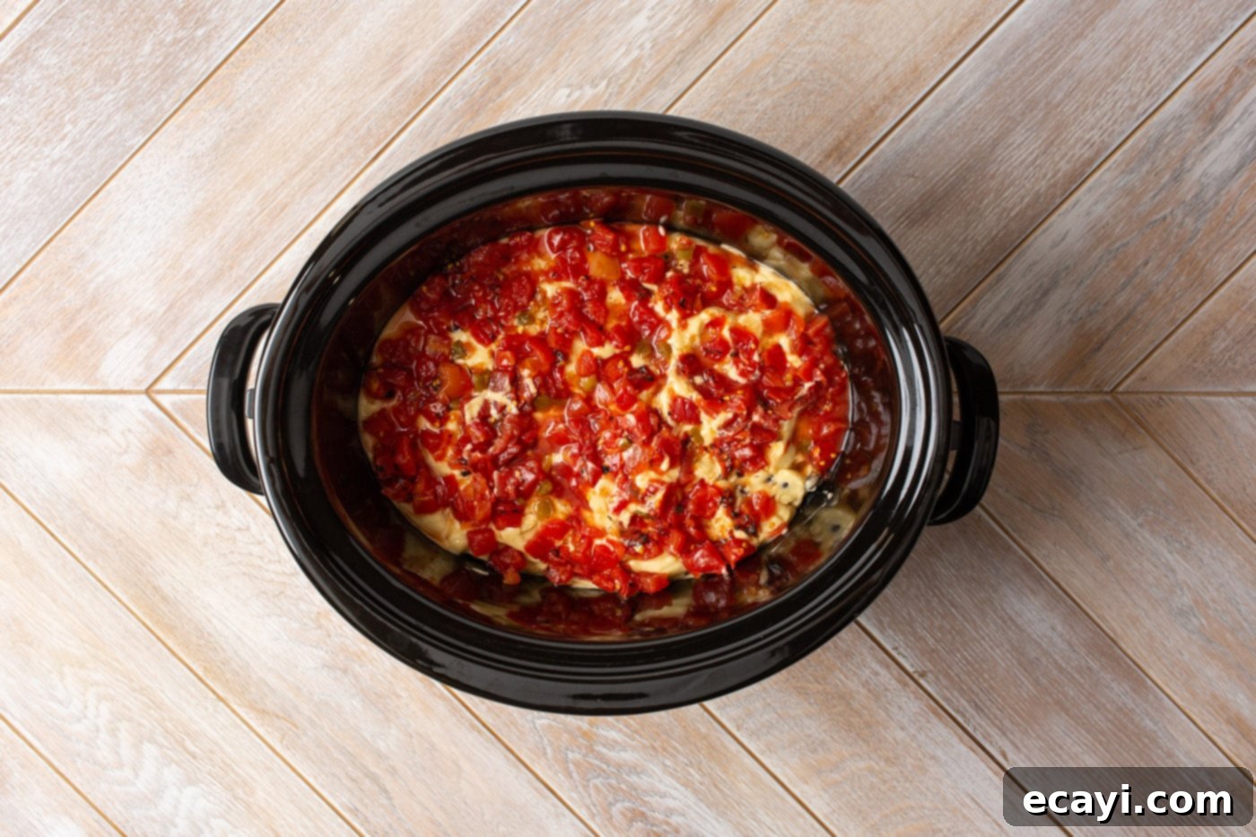 Slow Cooker Mexican Shredded Chicken 7 rotel tomatoes on top of cream of chicken and black beans