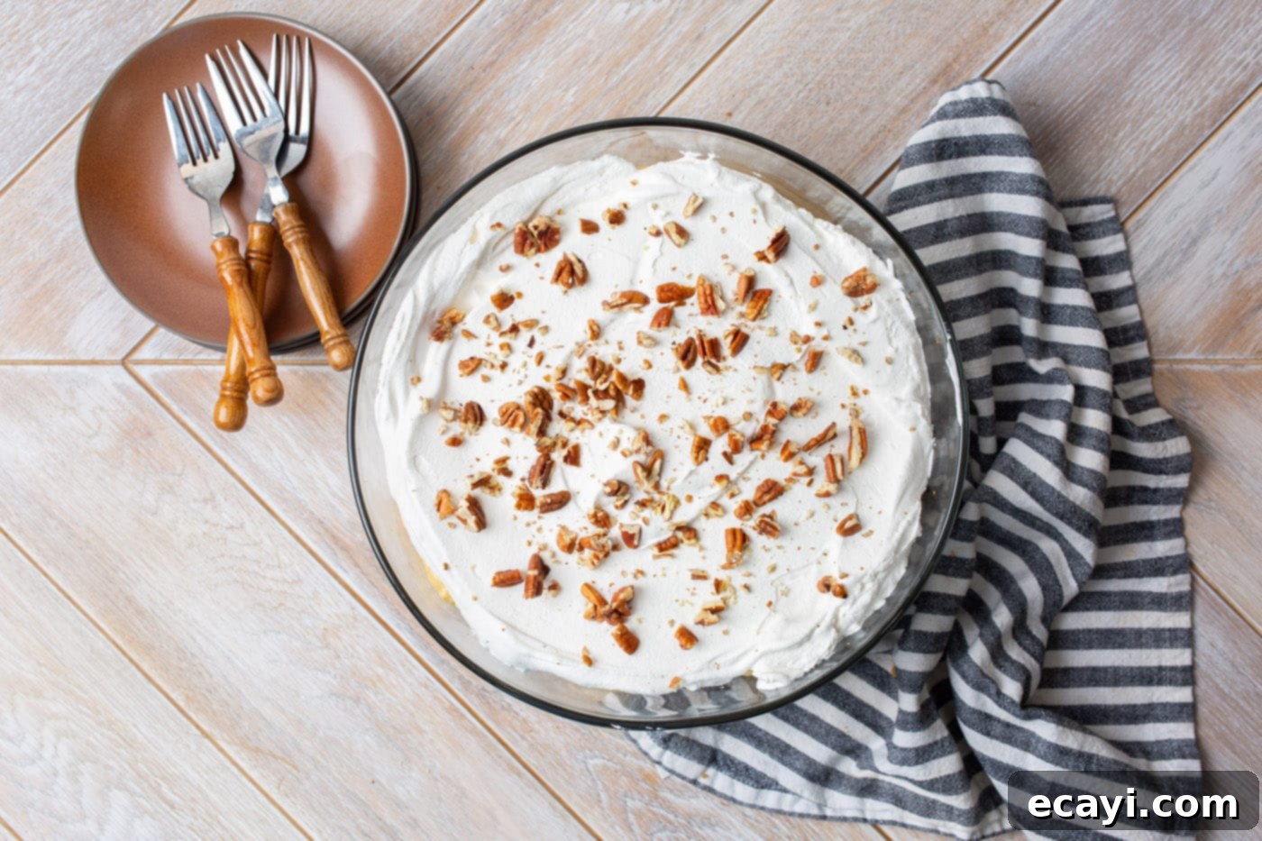 Autumn Pumpkin Delight 11 pecans on top of whipped topping in pumpkin trifle