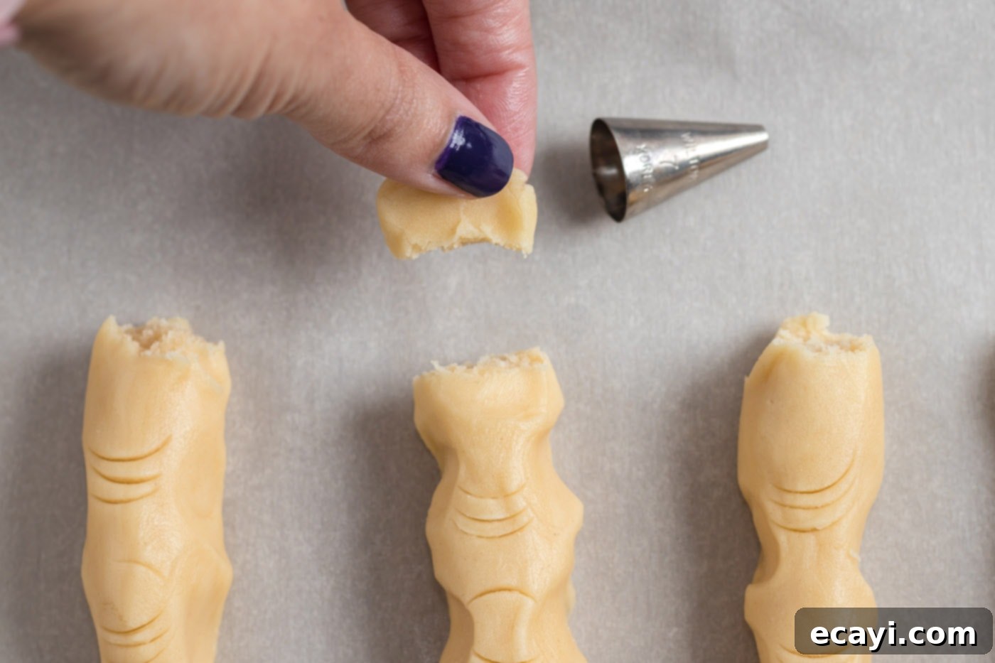 Wicked Fingers 13 Breaking off a small portion of cookie dough to create a realistic