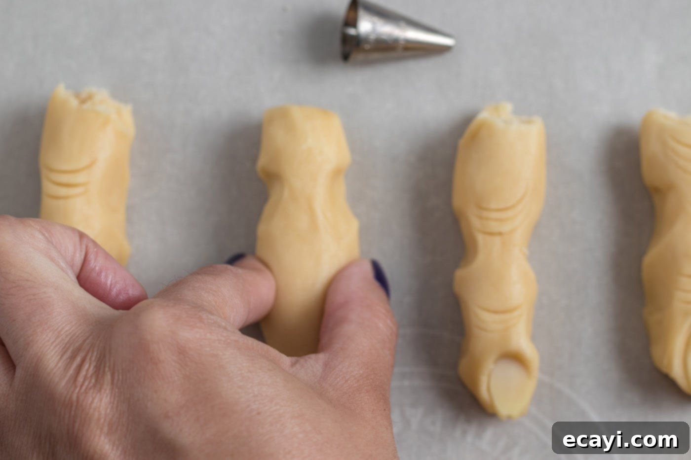 Wicked Fingers 10 Cookie dough being carefully pinched to create realistic knuckles and finger joints for a Witch Finger Cookie