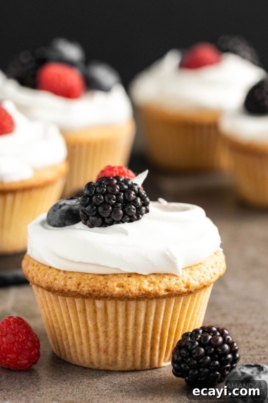 Golden Pound Cupcakes 3 Pound Cake Cupcake with berry garnish