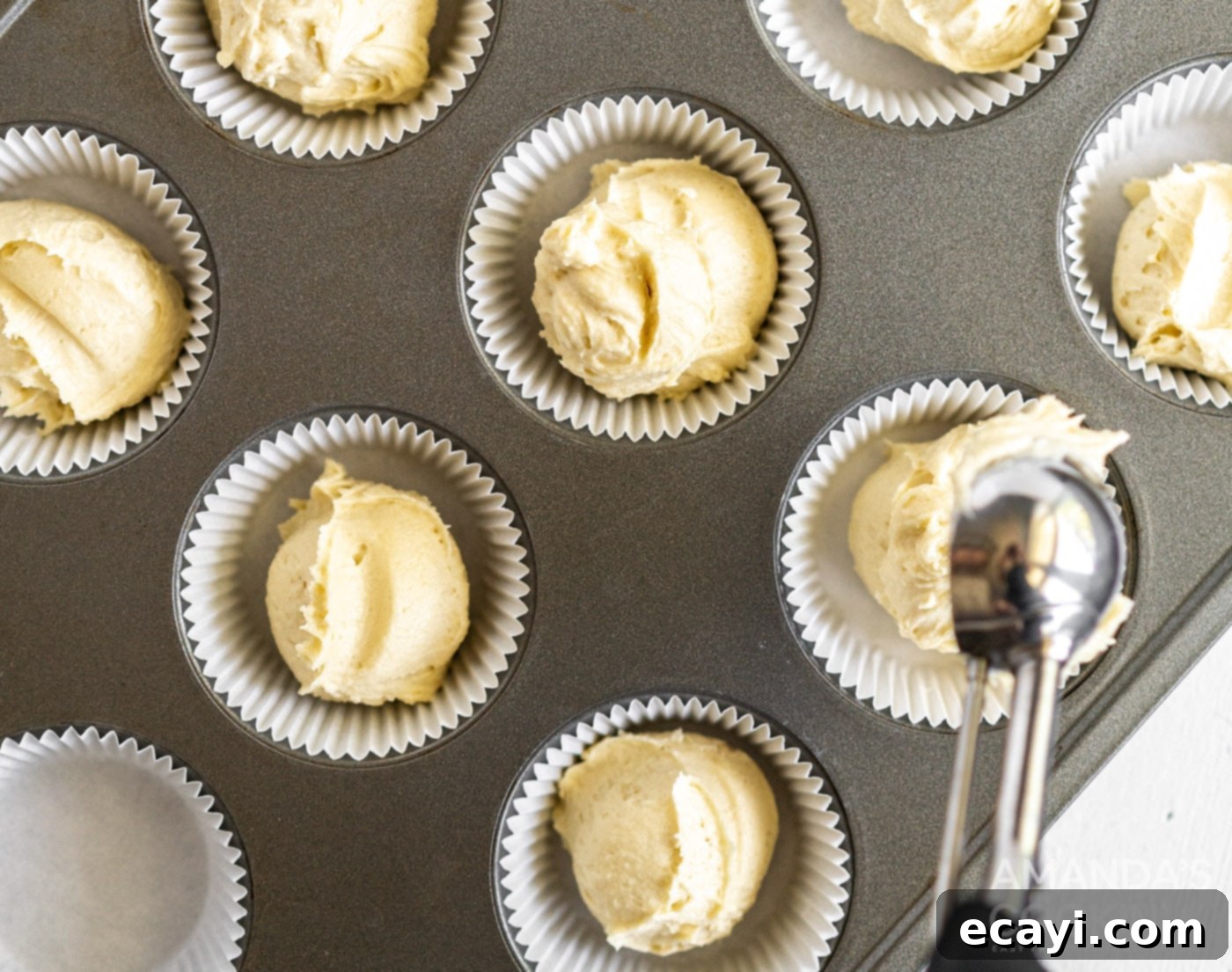 Golden Pound Cupcakes 8 pound cake batter spooned into muffin tin