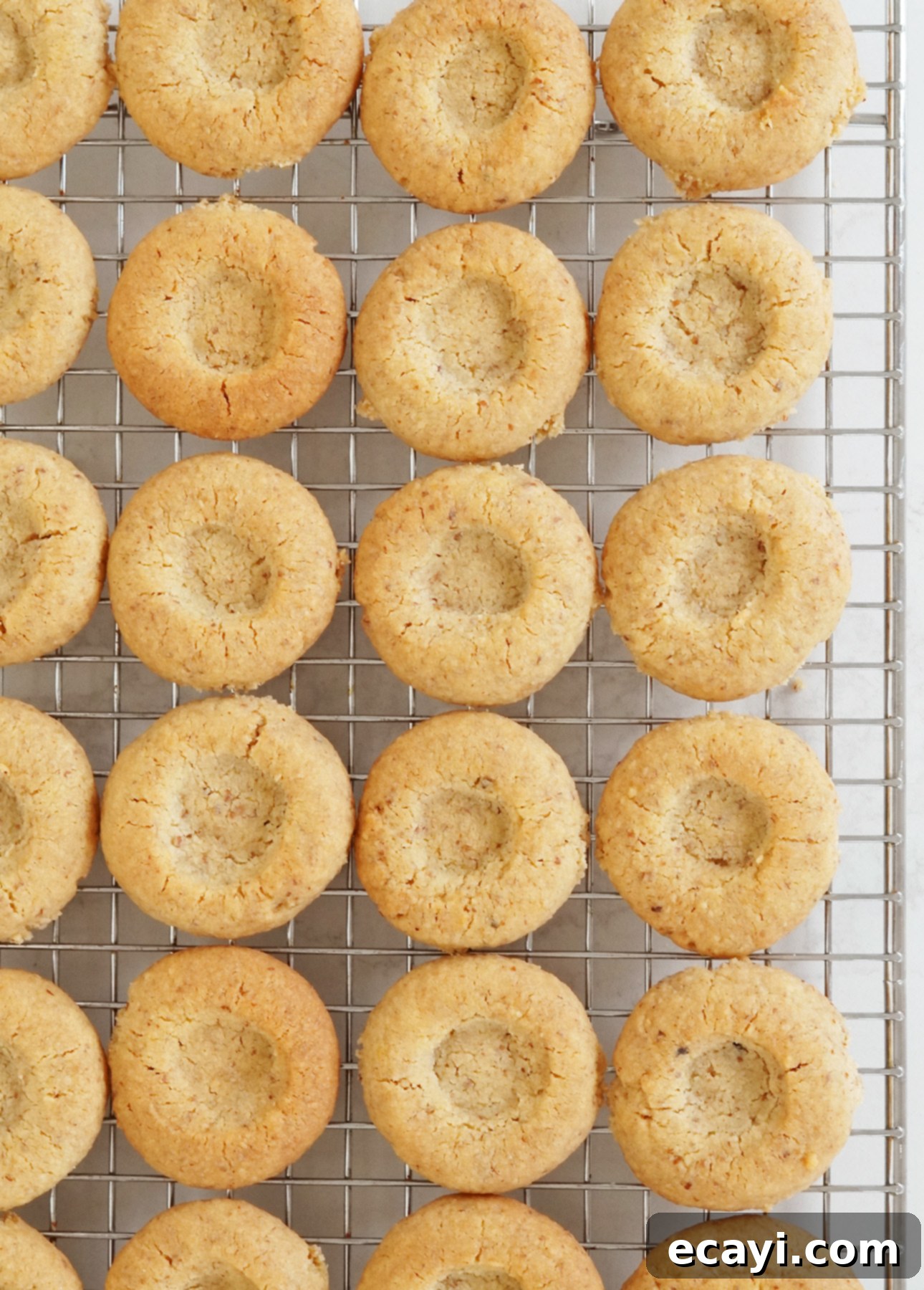 Golden Maple Pecan Indulgences 7 Baked maple thumbprint cookies, ready to be garnished with maple butter // foodnouveau.com