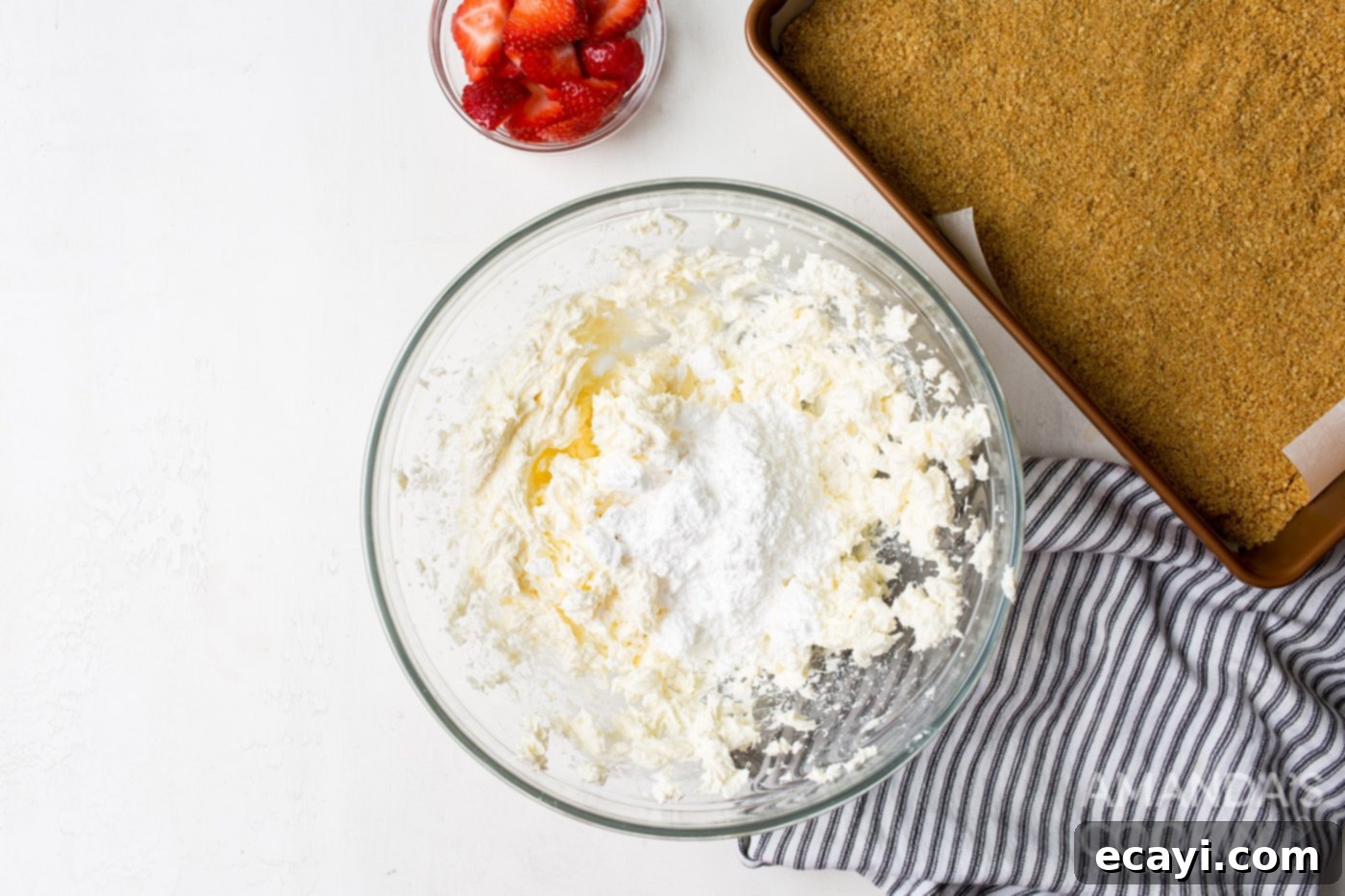 Chilled Cheesecake Squares 6 cream cheese with powdered sugar in a mixing bowl