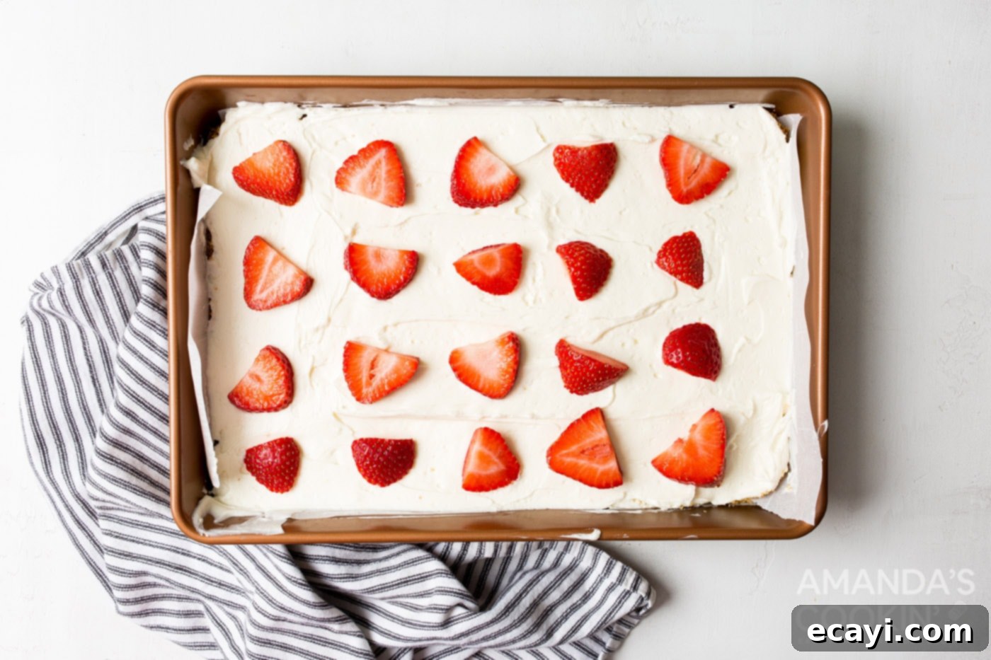 Chilled Cheesecake Squares 9 sliced strawberries on top of no bake cheesecake bars