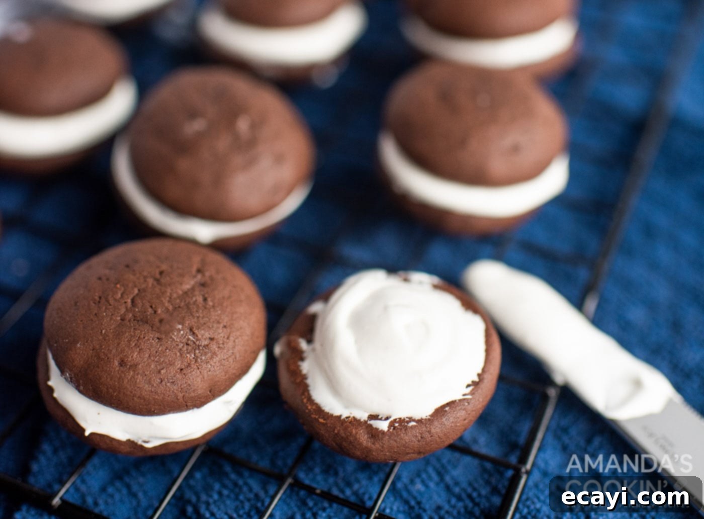 Velvety Chocolate Whoopie Indulgence 12 Assembled chocolate whoopie pies with marshmallow cream filling, ready to set.